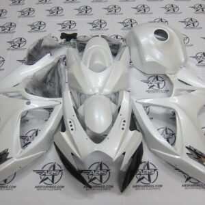 White motorcycle body fairings set displayed on table.