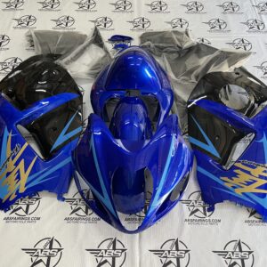 Blue motorcycle fairings with logo on display.