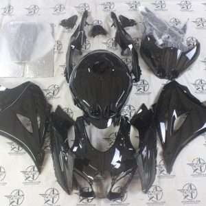 Black motorcycle fairing kit on ABS Fairings backdrop.