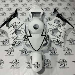 White motorcycle fairings with custom graphics on branded backdrop.