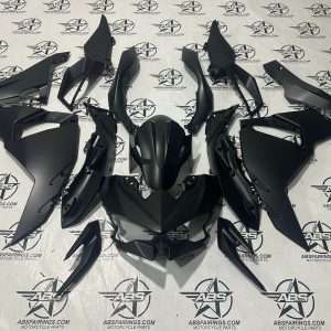 Black motorcycle fairings on ABS Fairings background.