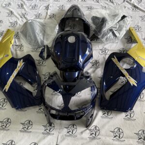 Motorcycle fairing kit with blue and yellow design.