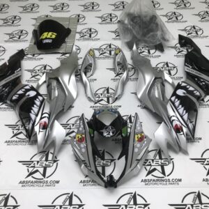 Silver motorcycle fairing kit with shark designs