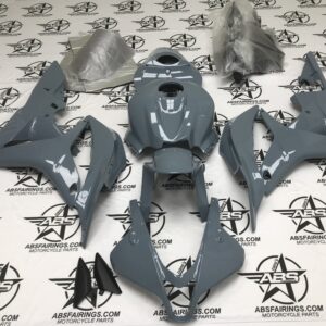 Gray motorcycle fairing kit on logo background.