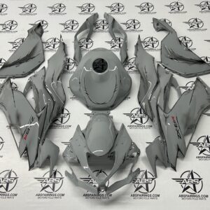 Gray motorcycle fairing parts on branded ABS Fairings backdrop.