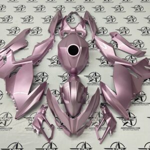 Pink motorcycle fairing kit parts displayed.