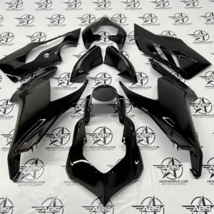Black motorcycle fairings on display