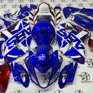Blue and red motorcycle fairing kit parts displayed.